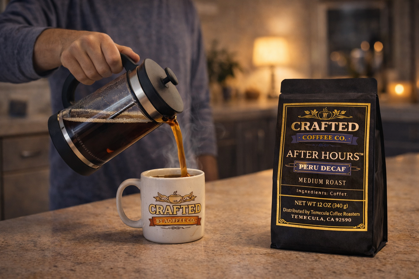 Person pouring After Hours Peru Decaf medium roast coffee from French press into mug on kitchen counter with evening lamp light