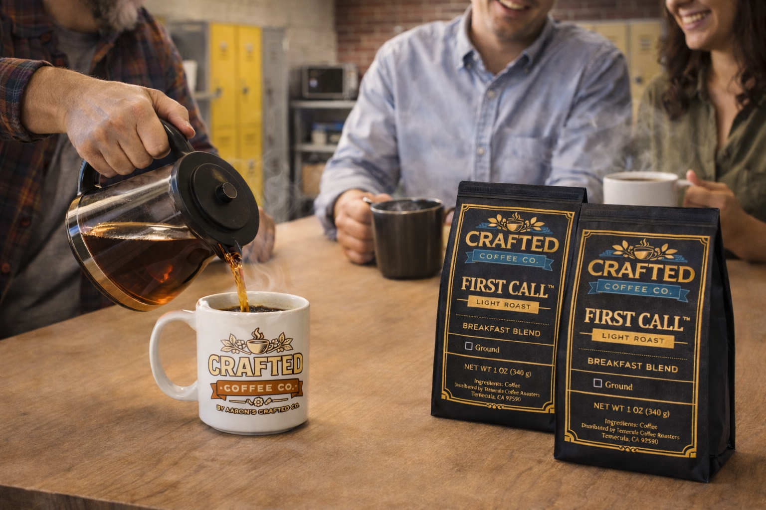 Group sharing First Call breakfast blend light roast coffee from carafe in break room with bags on table